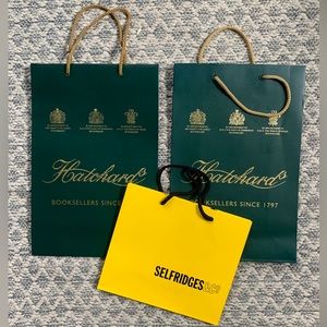 Two Hatchard’s shopping bags and one Selfridges shopping bag